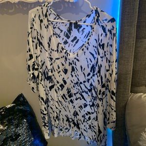 Navy blue and white patterned blouse